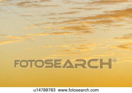 Stock Image - Cloudscape at sunset. Fotosearch