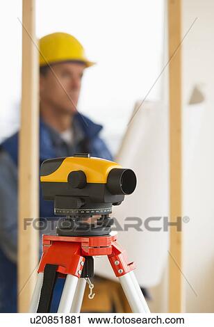 Construction worker with theodolite View Large Photo Image Stock Image - Construction worker with theodolite. Fotosearch