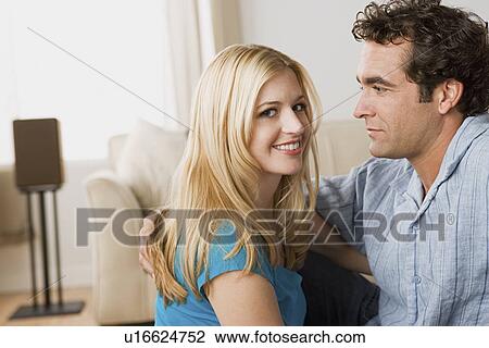 Stock Image - Couple at home party. Fotosearch