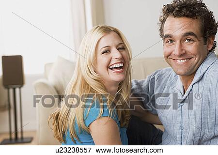Stock Photo - Couple at home party. Fotosearch