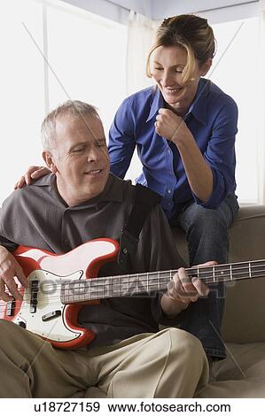Couple having fun with guitar View Large Photo Image Stock Photo - Couple having fun with guitar. Fotosearch