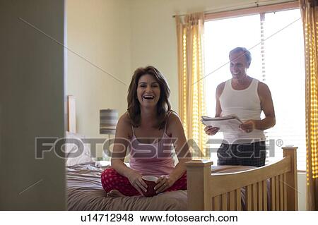 Stock Photo - Couple in bedroom. Fotosearch