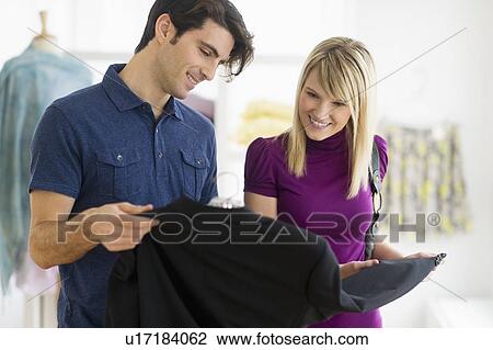Couple in clothes store View Large Photo Image Stock Image - Couple in clothes store. Fotosearch