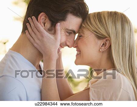 Picture - Couple rubbing with noses. Fotosearch