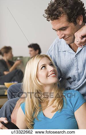 Couples at home party View Large Photo Image Stock Image - Couples at home party. Fotosearch