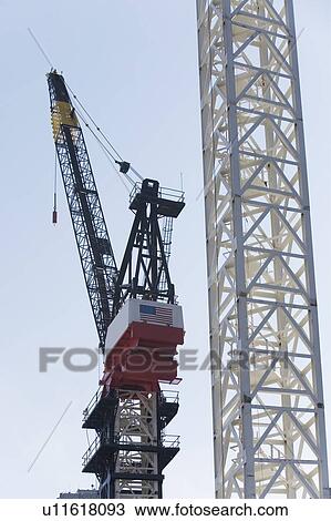 Stock Image - Crane at construction site. Fotosearch