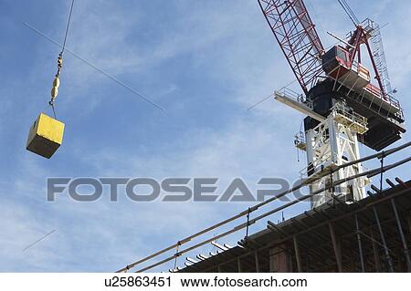 Stock Image - Crane hook carrying block. Fotosearch