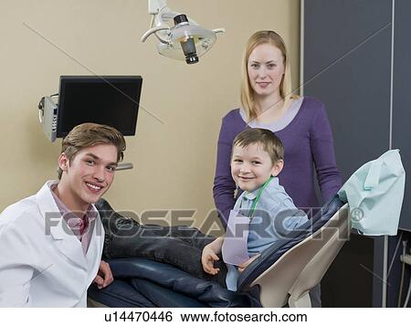Dentist and patients in dental surgery View Large Photo Image Stock Photograph - Dentist and patients in dental surgery. Fotosearch