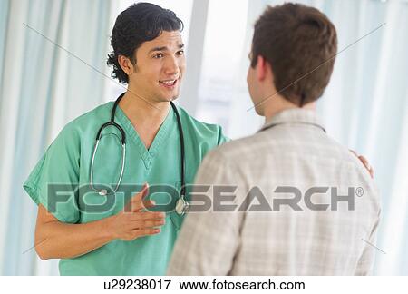 Stock Photo - Doctor and patient in hospital. Fotosearch