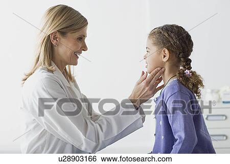 Doctor examining girl (10-11) View Large Photo Image Stock Photograph - Doctor examining girl (10-11). Fotosearch