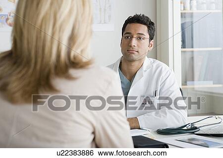 Doctor listening to patient View Large Photo Image Stock Photograph - Doctor listening to patient. Fotosearch