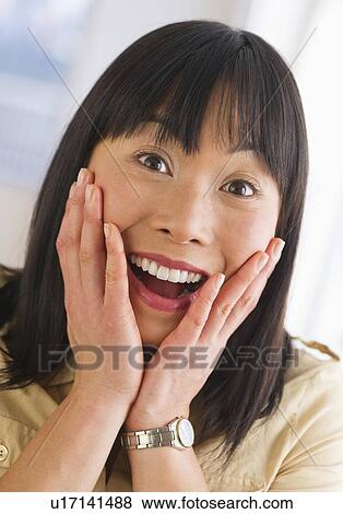 Stock Photo - Excited mid adult woman. Fotosearch