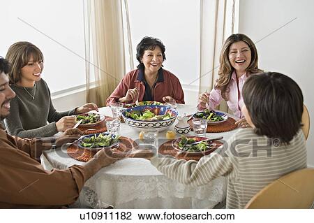 Family having meal together View Large Photo Image Stock Image - Family having meal together. Fotosearch