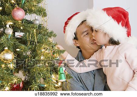 Father and daughter (10-11) decorating christmas tree View Large Photo Image Stock Image - Father and daughter (10-11) decorating christmas tree. Fotosearch