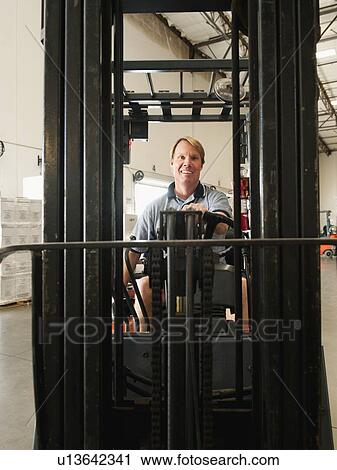 Forklift driver View Large Photo Image Stock Image - Forklift driver. Fotosearch