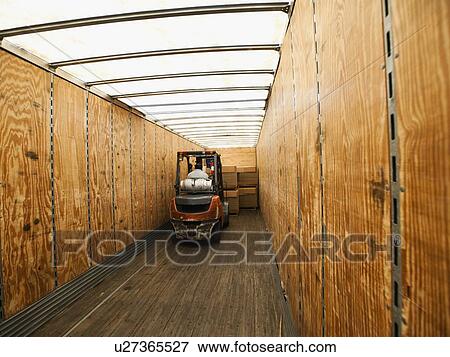 Forklift truck inside trailer View Large Photo Image Stock Photo - Forklift truck inside trailer. Fotosearch