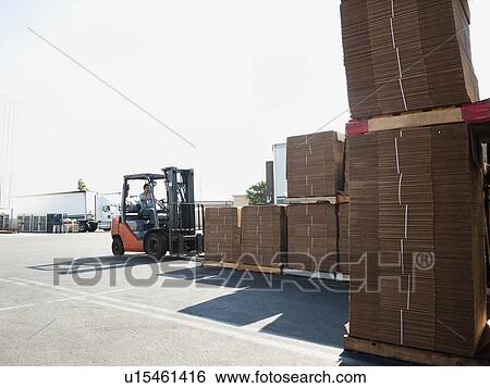 Forklift truck moving pallets View Large Photo Image Stock Photograph - Forklift truck moving pallets. Fotosearch