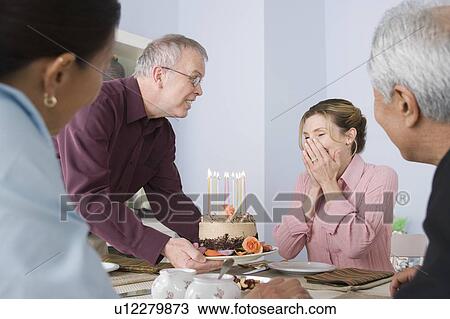 Friends celebrating mature women's birthday View Large Photo Image Stock Image - Friends celebrating mature women's birthday. Fotosearch