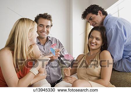 Friends having party at home View Large Photo Image Stock Image - Friends having party at home. Fotosearch