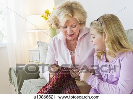 Grandmother with granddaughter (8-9) knitting at sofa View Large Photo Image Stock Image - Grandmother with granddaughter (8-9) knitting at sofa. Fotosearch