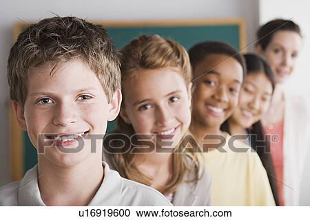 Group of schoolchildren posing together View Large Photo Image Stock Image - Group of schoolchildren posing together. Fotosearch