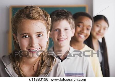 Group of schoolchildren posing together View Large Photo Image Stock Photograph - Group of schoolchildren posing together. Fotosearch