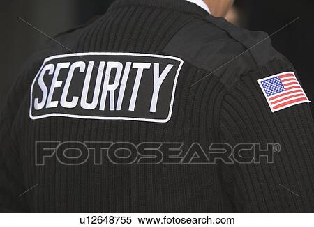 Stock Photography - Inscription on man's uniform. Fotosearch