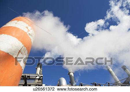 low angle view of factory chimneys View Large Photo Image Stock Image - low angle view of factory chimneys. Fotosearch