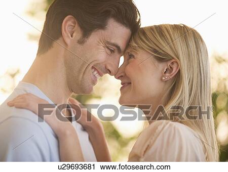 Stock Image - Man and woman looking at each other. Fotosearch