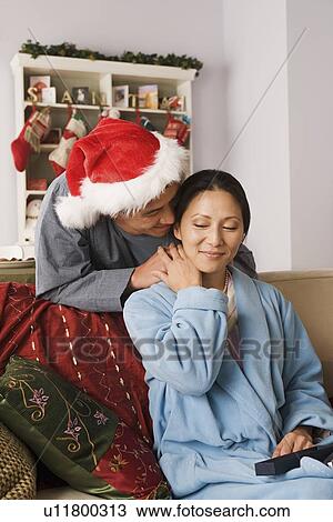 Man giving christmas gift to woman View Large Photo Image Stock Image - Man giving christmas gift to woman. Fotosearch