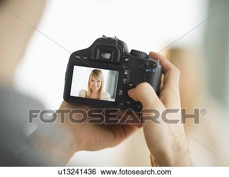 Man holding digital camera View Large Photo Image Stock Photograph - Man holding digital camera. Fotosearch