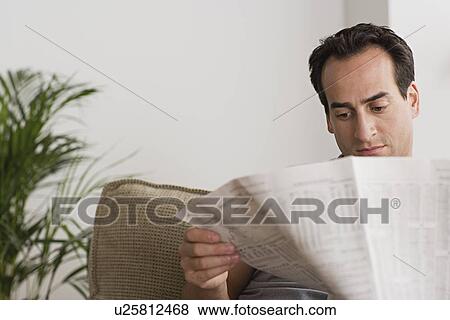 Stock Photo - Man reading newspaper. Fotosearch