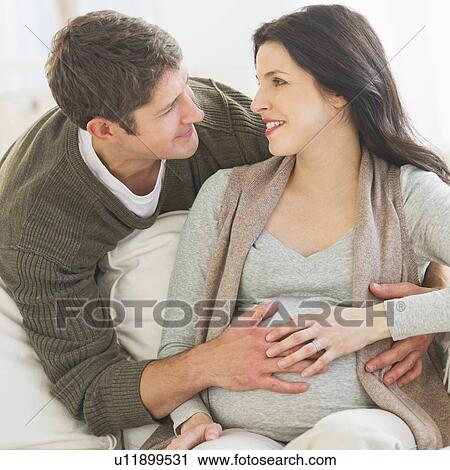 Man touching pregnant woman's belly View Large Photo Image Stock Image - Man touching pregnant woman's belly. Fotosearch