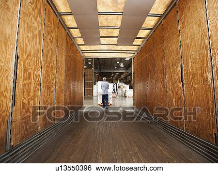 Man working in warehouse View Large Photo Image Stock Photograph - Man working in warehouse. Fotosearch