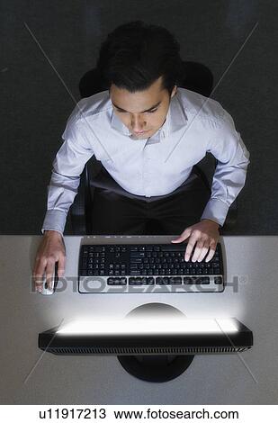 Man working with computer, studio shot View Large Photo Image Stock Image - Man working with computer, studio shot. Fotosearch
