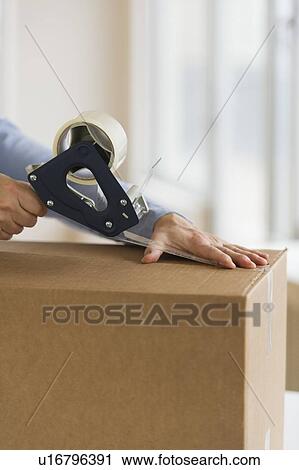 Man's hands packing delivery View Large Photo Image Stock Image - Man's hands packing delivery. Fotosearch