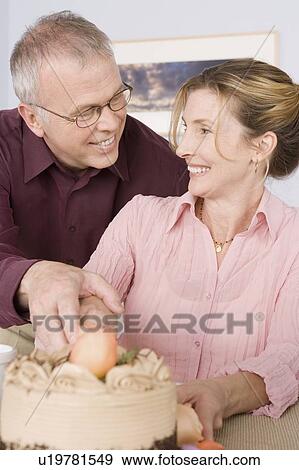 Mature couple celebrating birthday View Large Photo Image Stock Photo - Mature couple celebrating birthday. Fotosearch