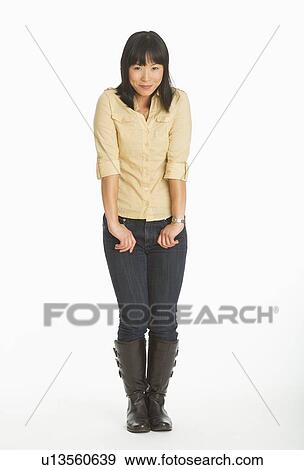 Mid adult smiling woman standing, studio shot View Large Photo Image Stock Photo - Mid adult smiling woman standing, studio shot. Fotosearch