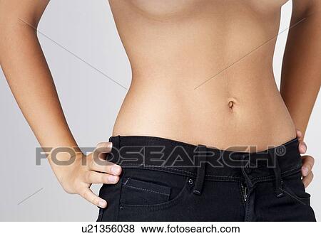 slim young woman with flat belly Stock 