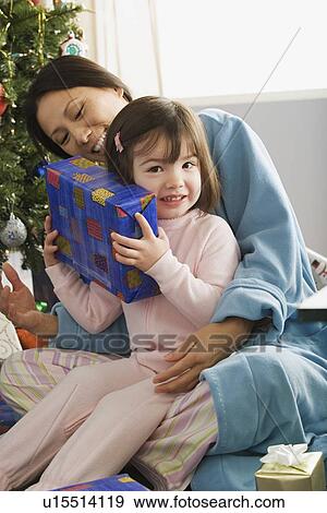 Mother and daughter (10-11) at Christmas morning View Large Photo Image Stock Photo - Mother and daughter (10-11) at Christmas morning. Fotosearch