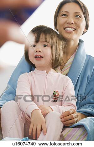 Mother and daughter at Christmas morning View Large Photo Image Stock Image - Mother and daughter at Christmas morning. Fotosearch