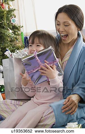 Mother and daughter at Christmas morning View Large Photo Image Stock Image - Mother and daughter at Christmas morning. Fotosearch
