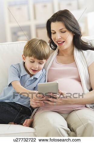 Mother and son (4-5) using tablet pc View Large Photo Image Stock Image - Mother and son (4-5) using tablet pc. Fotosearch