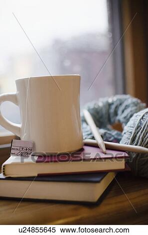 Mug with tea on books View Large Photo Image Stock Photography - Mug with tea on books. Fotosearch