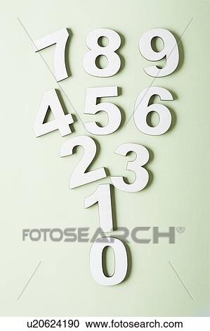 Stock Image - Numbers on white background, studio shot. Fotosearch