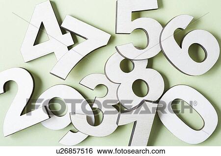 Stock Photograph - Numbers on white background, studio shot. Fotosearch
