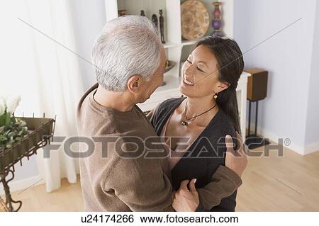 Older couple in embrace View Large Photo Image Stock Photograph - Older couple in embrace. Fotosearch