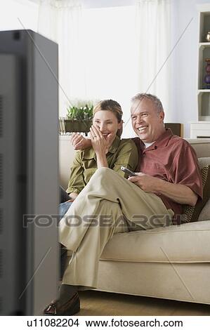Older couple watching tv View Large Photo Image Picture - Older couple watching tv. Fotosearch