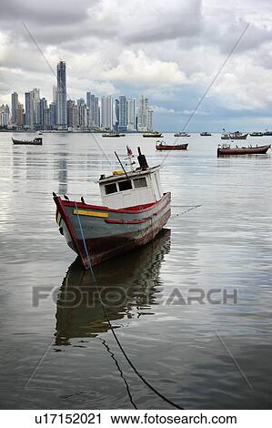 Panama, Panama City, Fishing boat with skyline in background View Large Photo Image Stock Image - Panama, Panama City, Fishing boat with skyline in background. Fotosearch