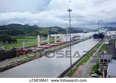 Stock Image - Panama, Panama City, Ship in canal lock. Fotosearch